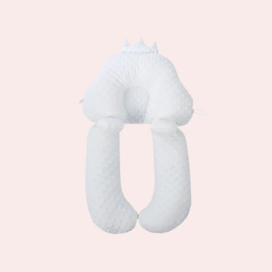 White crown-shaped baby support pillow with round center pad and two long side rolls