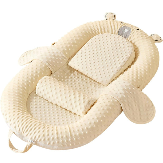 Yellow animal-shaped baby nest with raised padded border and cream center