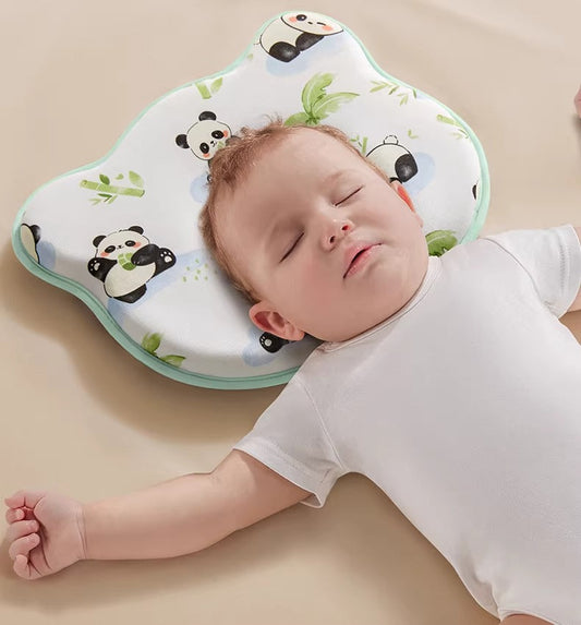 Panda-print hollow-center infant pillow shown beneath a sleeping baby in the Shopify featured image