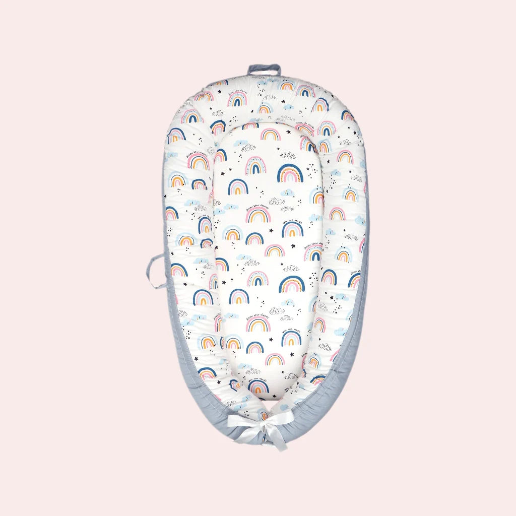 Cotton baby lounger nest for newborns with rainbow pattern
