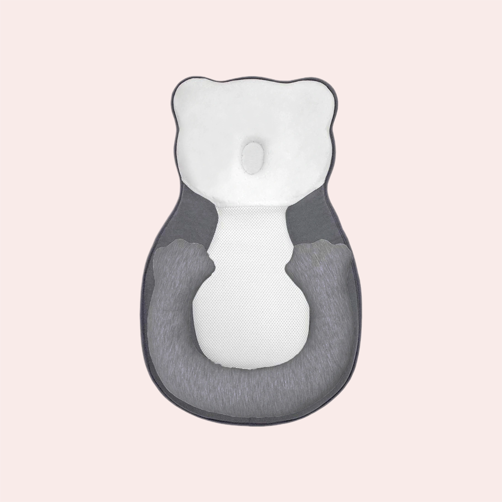 Newborn head shaping pillow in gray and white with leg support