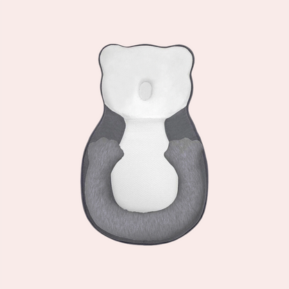 Newborn head shaping pillow in gray and white with leg support