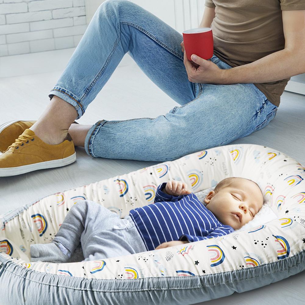 Newborn co sleeping lounger used for safe indoor relaxation