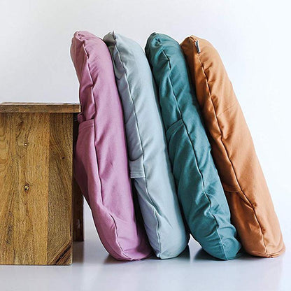 Stack of colorful soft baby lounger cushion options