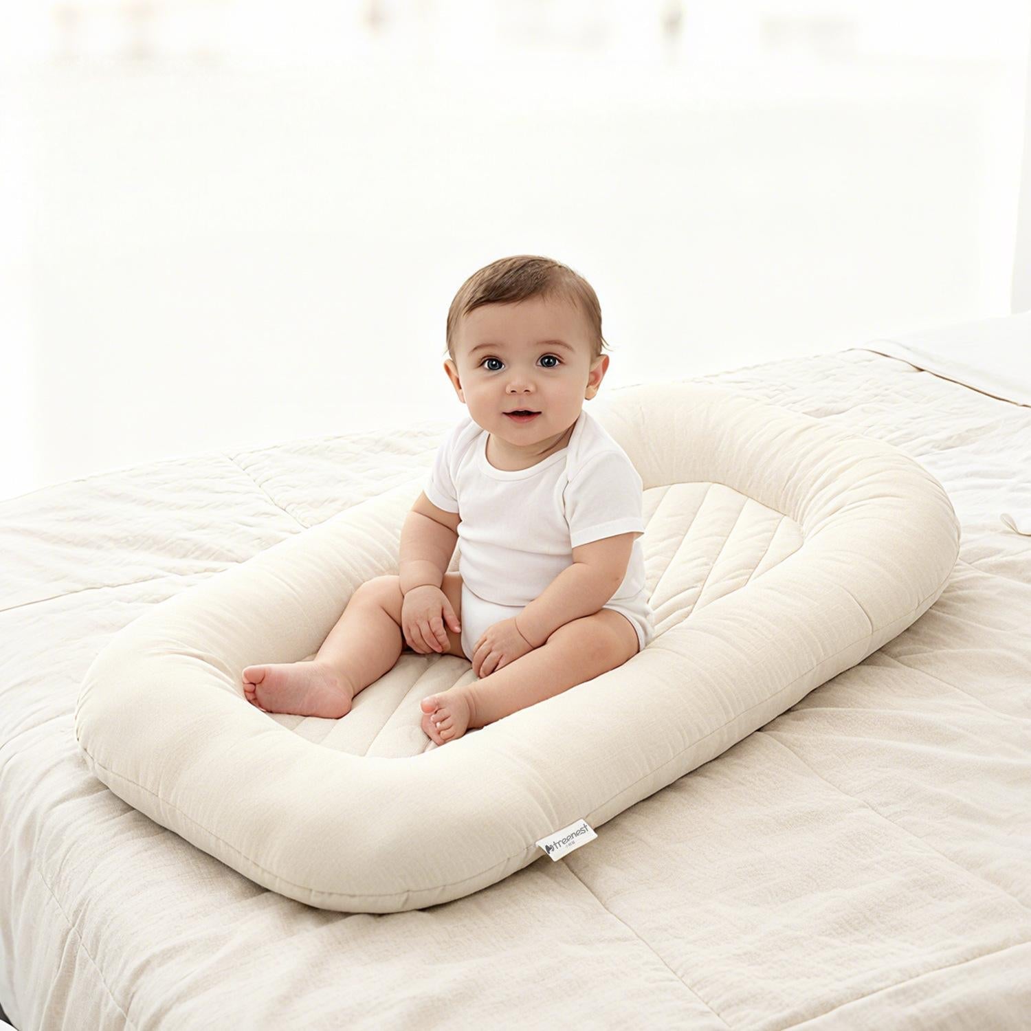 Soft newborn lounger bed supporting infant nap time