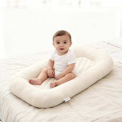 Soft newborn lounger bed supporting infant nap time