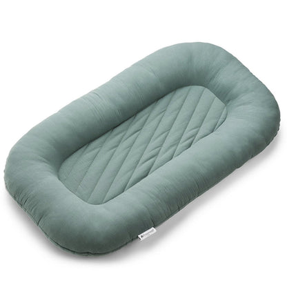 Green striped infant lounger bed