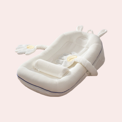 Baby inclined anti spill bed crib in white with play arch and head pillow