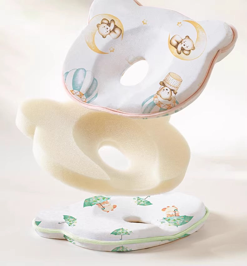 Breathable hypoallergenic baby pillow in woodland pattern supporting newborn head.