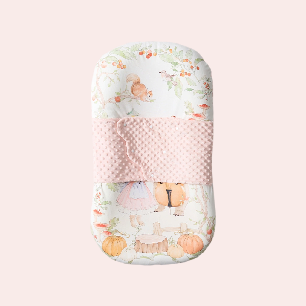 Ergonomic sleep pod for newborns in bunny strawberry garden pattern