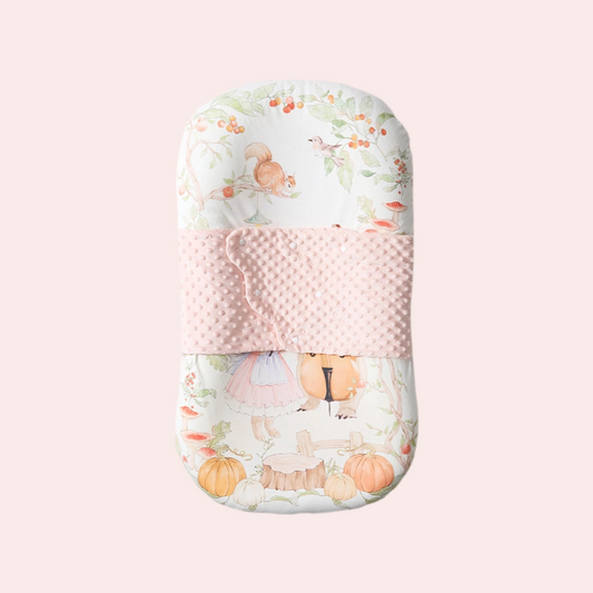 Ergonomic sleep pod for newborns in bunny strawberry garden pattern