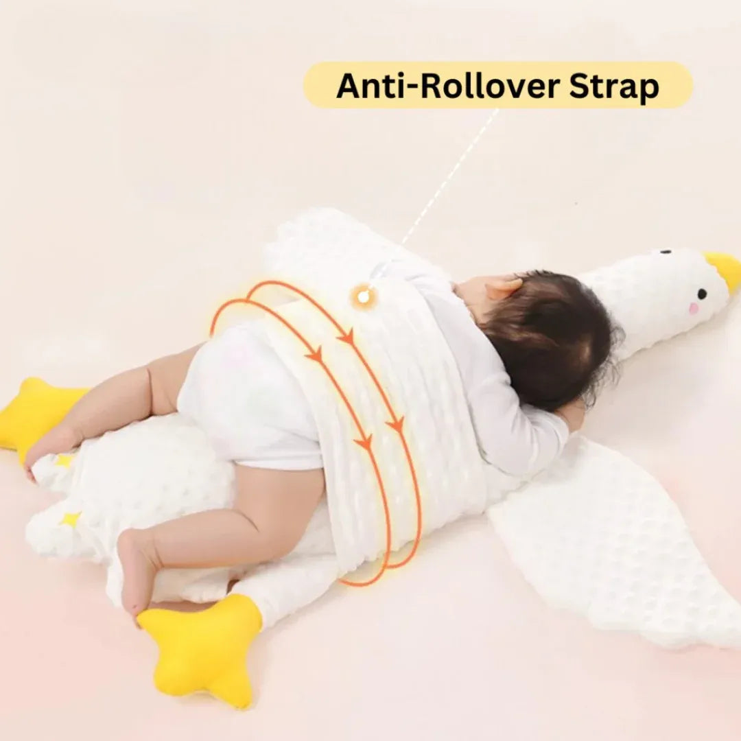 Baby resting comfortably on goose shaped support pillow