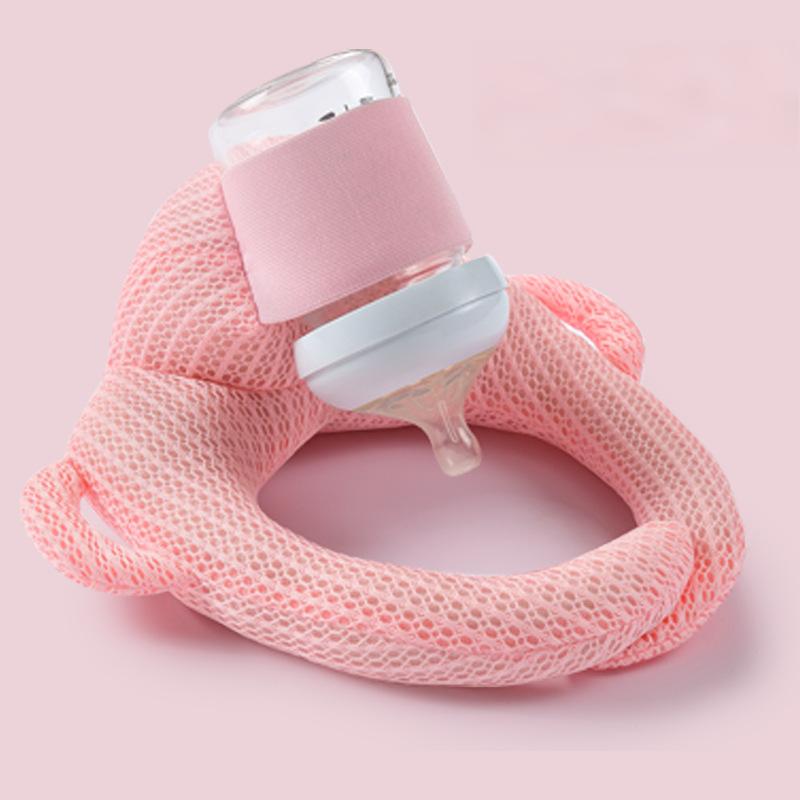 Pink hands free baby feeding pillow for infants